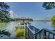 Picturesque boat dock featuring a covered slip and tranquil lake views at 18205 Royal Oak Rd, Charlotte, NC 28278