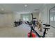 This large bonus room features workout equipment, a keyboard, and plenty of space for activities and hobbies at 18205 Royal Oak Rd, Charlotte, NC 28278