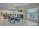 Inviting dining room featuring a fireplace and access to outdoor views, seamlessly connecting indoor and outdoor spaces at 18205 Royal Oak Rd, Charlotte, NC 28278