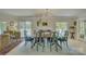 Elegant dining room with stylish furnishings, natural light, and access to an outdoor deck at 18205 Royal Oak Rd, Charlotte, NC 28278