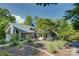 Charming home exterior surrounded by mature trees and landscaping with a well-maintained yard at 18205 Royal Oak Rd, Charlotte, NC 28278