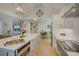 Spacious kitchen with white cabinets, stainless steel appliances, large island, and open floor plan at 18205 Royal Oak Rd, Charlotte, NC 28278