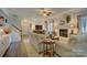 Spacious living room featuring a brick fireplace, neutral sofas, and ample space for relaxation and entertaining at 18205 Royal Oak Rd, Charlotte, NC 28278