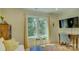 Comfortable sitting room with a view of the lake, providing a tranquil retreat for relaxation and reflection at 18205 Royal Oak Rd, Charlotte, NC 28278
