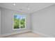Bright bedroom featuring large windows, providing lots of natural light and outside views at 19329 Watermark Dr # 422, Cornelius, NC 28031