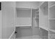 The walk-in closet offers custom built-in shelving and ample storage space for clothing and accessories at 19329 Watermark Dr # 422, Cornelius, NC 28031