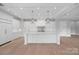 Spacious kitchen boasts an oversized center island with marble counters and pendant lighting at 19329 Watermark Dr # 422, Cornelius, NC 28031