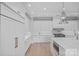 Chef's kitchen with marble countertops, stainless steel appliances, and custom cabinetry at 19329 Watermark Dr # 422, Cornelius, NC 28031
