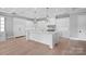 Gourmet kitchen with a large center island, modern appliances, and custom cabinetry at 19329 Watermark Dr # 422, Cornelius, NC 28031