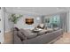 Cozy living room with a plush sectional, hardwood floors, and a wall-mounted TV at 19329 Watermark Dr # 422, Cornelius, NC 28031
