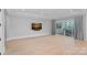 Open living space featuring hardwood floors, large windows, and access to outdoor balcony at 19329 Watermark Dr # 422, Cornelius, NC 28031