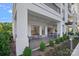 An exterior view of a patio featuring a seating area, and lush greenery, creating a relaxing outdoor space at 19329 Watermark Dr # 422, Cornelius, NC 28031
