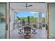 This patio features a black metal table and chairs and a view of the green treeline at 19329 Watermark Dr # 422, Cornelius, NC 28031