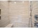 Modern walk-in shower features elegant tilework, built in bench, and sleek fixtures at 19329 Watermark Dr # 422, Cornelius, NC 28031
