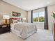 Inviting bedroom with a comfortable queen-sized bed, cozy lighting, and a large window with views at 223 Halemarg Dr, Belmont, NC 28012