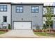 Charming home exterior with a white garage door, manicured landscaping, and a well-maintained driveway at 223 Halemarg Dr, Belmont, NC 28012