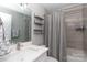 Bathroom featuring a modern vanity, a tub with a shower, and stylish shelves for organization at 232 Harmony Hills Dr, Catawba, SC 29704