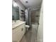 Modern bathroom featuring a shower and tub combo, neutral tile, white vanity, and contemporary fixtures at 232 Harmony Hills Dr, Catawba, SC 29704