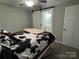 Charming bedroom featuring a ceiling fan, plush carpet, neutral walls, and lots of natural light at 232 Harmony Hills Dr, Catawba, SC 29704