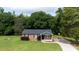 Charming single-story brick home with a well-manicured lawn and basketball court at 232 Harmony Hills Dr, Catawba, SC 29704