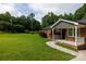 Lovely brick house with a well-kept lawn, front porch, and paved walkway at 232 Harmony Hills Dr, Catawba, SC 29704