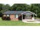 Inviting brick house with a cozy front porch and landscaped garden at 232 Harmony Hills Dr, Catawba, SC 29704