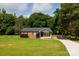 Charming brick home with a well-manicured lawn, complemented by mature trees and a basketball hoop on the driveway at 232 Harmony Hills Dr, Catawba, SC 29704