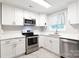 Bright kitchen with stainless appliances, white cabinetry, white countertops, and a window providing natural light at 232 Harmony Hills Dr, Catawba, SC 29704