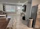 Spacious living room with open layout, hardwood flooring, neutral walls, and stainless steel appliances at 232 Harmony Hills Dr, Catawba, SC 29704