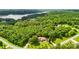 Expansive aerial view features home on a large lot surrounded by mature trees and greenery at 234 Rivercliff Dr, Stony Point, NC 28678