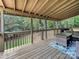 Cozy covered porch area with a patio dining and seating, perfect for entertaining at 234 Rivercliff Dr, Stony Point, NC 28678