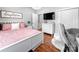Cozy bedroom featuring a pink bed, modern furniture, and a lovely chandelier at 234 Rivercliff Dr, Stony Point, NC 28678