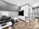 Modern living room featuring sleek white built-ins and contemporary decor at 234 Rivercliff Dr, Stony Point, NC 28678