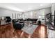 Spacious living room with hardwood floors, plush seating, and an abundance of natural light at 234 Rivercliff Dr, Stony Point, NC 28678