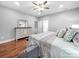 Comfortable main bedroom featuring a decorative bed, a dresser, and laminate floors at 234 Rivercliff Dr, Stony Point, NC 28678