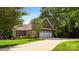Brick home with an attached, multi-car garage and a well-manicured yard with driveway at 234 Rivercliff Dr, Stony Point, NC 28678