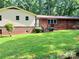 Lawn with a view of the home's brick and siding exterior, with stairs to the back entrance at 237 Antietam Rd, Statesville, NC 28625