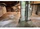 Unfinished basement with concrete floor, exposed brick and ductwork offers potential for customization and additional living space at 237 Antietam Rd, Statesville, NC 28625