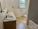 Bathroom featuring double sinks, a large mirror, and a window for natural light at 237 Antietam Rd, Statesville, NC 28625