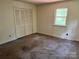 Bedroom with a closet, a window, neutral walls and carpeted floor at 237 Antietam Rd, Statesville, NC 28625
