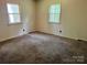 Bedroom with two windows, neutral walls and carpeted floor at 237 Antietam Rd, Statesville, NC 28625