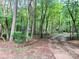 A long gravel driveway that leads to a wooded area; address sign is visible at 237 Antietam Rd, Statesville, NC 28625