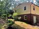 Side view of the home with a mix of siding and brick, complimented by mature landscaping at 237 Antietam Rd, Statesville, NC 28625
