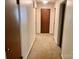 Hallway with carpet, white walls, and multiple doorways at 237 Antietam Rd, Statesville, NC 28625