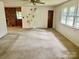 Spacious living room boasting abundant natural light and views, with a ceiling fan for added comfort at 237 Antietam Rd, Statesville, NC 28625