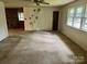 Living room with bright windows, light walls, and transition to another living area at 237 Antietam Rd, Statesville, NC 28625