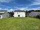 Expansive backyard view showcasing a well-maintained lawn perfect for outdoor activities and relaxation at 2819 Cougar Hill Ct, Charlotte, NC 28216