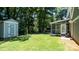 Spacious backyard featuring a shed and screened porch, perfect for outdoor enjoyment at 3008 Heathcroft Ct, Charlotte, NC 28269