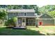 Exterior view of the home showing a large backyard with a screened in porch at 3008 Heathcroft Ct, Charlotte, NC 28269