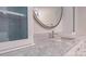 Close-up of a bathroom vanity with marble countertop, modern faucet, and cabinet with decorative tile at 3008 Heathcroft Ct, Charlotte, NC 28269